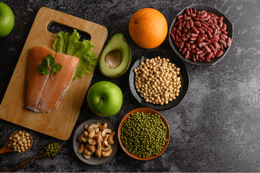 Best Foods to Lower LDL Cholesterol – A heart-healthy selection of salmon, nuts, legumes, and fresh fruits that help reduce bad cholesterol naturally.